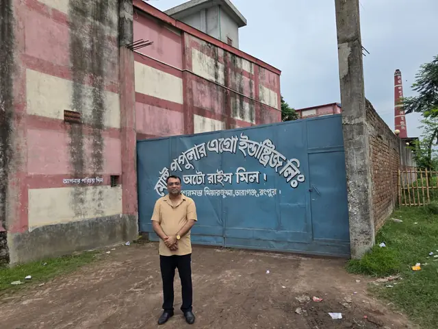 Abdul Kader Chowdhury at the gate of the Most Popular Agro Industries auto rice mill
